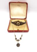 A boxed Victorian Bohemian yellow metal rose cut garnet floral design bangle along with a gold