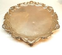 A large Victorian Mappin Brothers silver butler's tray with scalloped edges and shell motifs mounted