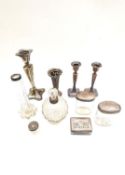 A collection of silver and silver plate including, a weighted silver plated candlestick, a pair of