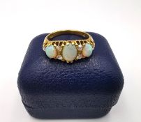 A boxed Victorian 18ct yellow gold opal and rose cut diamond carved half hoop ring by Alabaster &
