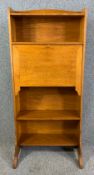 A C.1900 oak Arts and Crafts student bureau. H.138 W.62 D.33cm