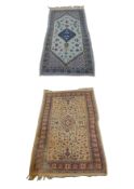 A Persian rug along with a Senneh rug. L.100 W.63cm. L.155 W.93cm.