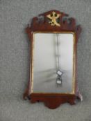 A Georgian mahogany wall mirror with carved gilt Ho-Ho bird cresting. H.80 W.45cm.