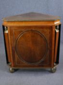 Corner cabinet, walnut, ebony and brass inlaid Egyptian revival with central panel door flanked by