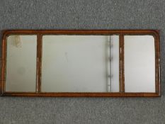 A Georgian walnut and carved giltwood three section wall or overmantel mirror with original
