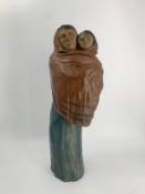 A polychrome bronze figure group, mother and child, monogrammed and dated. H.57cm