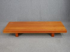 A contemporary cherrywood low coffee table. H.25 W.180 D.62cm.