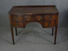 A Georgian style mahogany dressing table. H.76 W.99 D.50cm.