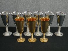 A set of six silver plated goblets along with a similar set of three in gold plate. H.18cm. (