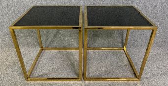 A pair of brass and smoked plate glass lamp or occasional tables. H.51 W.47 D.47cm