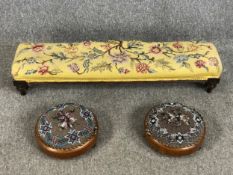 A Victorian mahogany hearth stool and a pair of 19th century walnut tapestry upholstered and