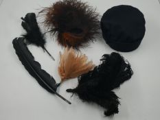 An early 20th century Garrould nurse's hat and a collection of milliners feathers. L.39cm (largest).