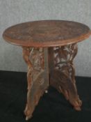 A vintage Indian carved hardwood occasional table. H.40 Dia. 38cm.