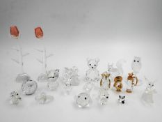 A miscellaneous collection of boxed Swarovski crystal miniatures, including various animals with