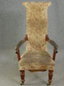 A George IV mahogany armchair raised on tapering reeded supports.