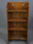 A late 19th century Arts and Crafts light oak open bookcase in the manner of Liberty & Co. H.94 W.46