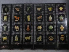 A Chinese lacquered six panel screen with applied carved soap stone and hardstone decoration and