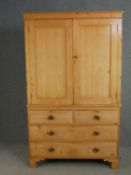 A Victorian William Smee pine press cupboard with hanging space above drawers and maker's label to