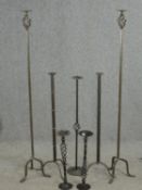 Two pairs of wrought iron floor standing pricket candlestands along with three other similar. H.