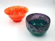 Two mid century studio glass bowls, one with a sandblasted peacock feather design on speckled purple