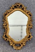 A 19th century style gilt framed mirror. H.71 W.42cm