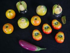 A collection of early 20th century hand decorated ceramic fruit, viz: Apples, pears and tomatoes. (