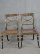 A pair of Regency dining chairs, parcel gilt and hand decorated with lion's mask detail to the