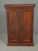 A 19th century pine wall hanging cabinet. H.88 W.59 D.17cm.