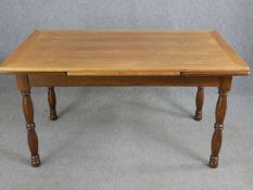 A 19th century style oak draw leaf dining table. H.75 W.224 D.90cm. (ext).