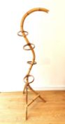 A vintage bamboo snake form plant stand. H.146 L.63 W.50cm.