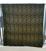 A black, linen backed textile wall hanging with embroidered Arabic text, possibly verses from the