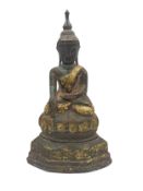 A bronze and gilded seated Buddha figure. H.24cm.