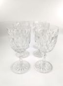 A set of six Baccarat crystal water glasses, one with chip to foot. H.16.5cm