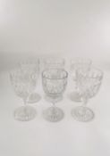A set of six Baccarat crystal wine glasses, one shorter in height. H.15cm