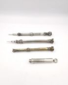 A set of four silver propelling pencils, three marked Sampson Mordan & Co. with semi precious stones