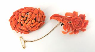 Two Victorian coral brooches of floral form, sprung on metal wire with pin backing (one to include a