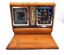 A LeCoultre eight day travel clock with barometer and thermometer. Case L.14.5 W.11.7cm (clocks 5.