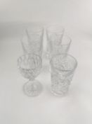 Four Baccarat crystal tall boys, a shorter version and a sherry glass. H.14cm tallest
