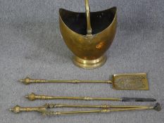 A 19th century brass coal bucket and a set of similar fire irons. L.82cm. (largest).