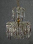 A vintage metal framed chandelier of basket form with cut crystal drops. H.95 Dia.32cm.