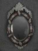 A vintage Venetian style wall mirror. H.77 W.45cm.
