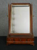 A Georgian mahogany swing frame toilet mirror. H.60 W.40 D.20cm.