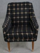 A mid century salon armchair in original upholstery. H.76cm.
