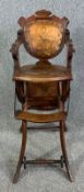 A late 19th century oak metamorphic child's high chair converting to push chair. H.94 W.33 D.37cm