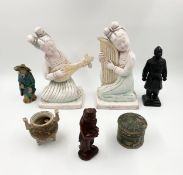 A collection of seven Oriental figures and other objects including two terracotta, one carved