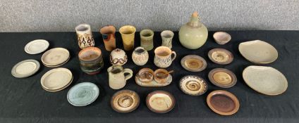 A collection of British studio pottery to include Tony Grant vase, The Friars pottery, Briglin