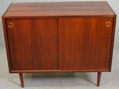 A small mid century teak sideboard. H.81 W.100 D.44cm..