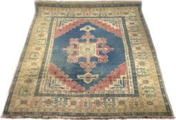 A large Persian Abadeh carpet, the central floral medallion on a petrol blue ground within