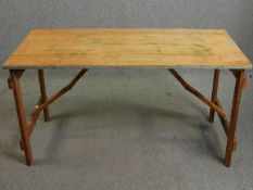 A mid century folding trestle table stamped: Boulton & Paul Ltd. H.71 W.136 D.67cm.