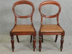 A pair of Victorian mahogany balloon back chairs.